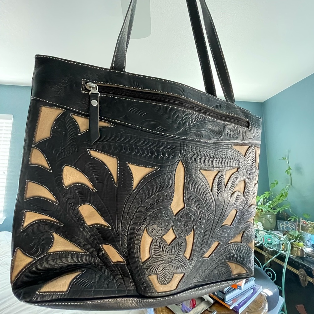 Leaders in Leather shoulder bag. Cut out design.